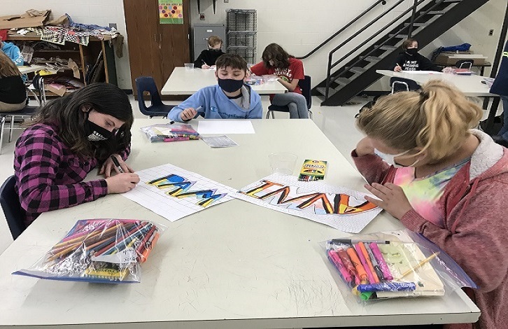 Middle school students in art class