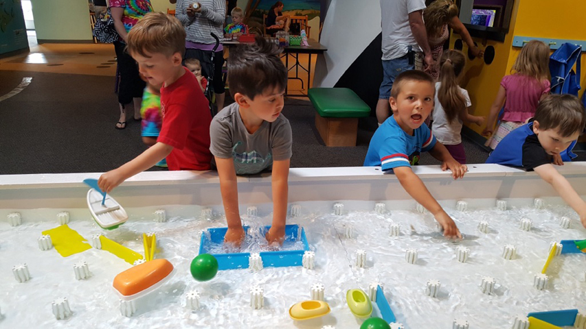 Children playing at water table